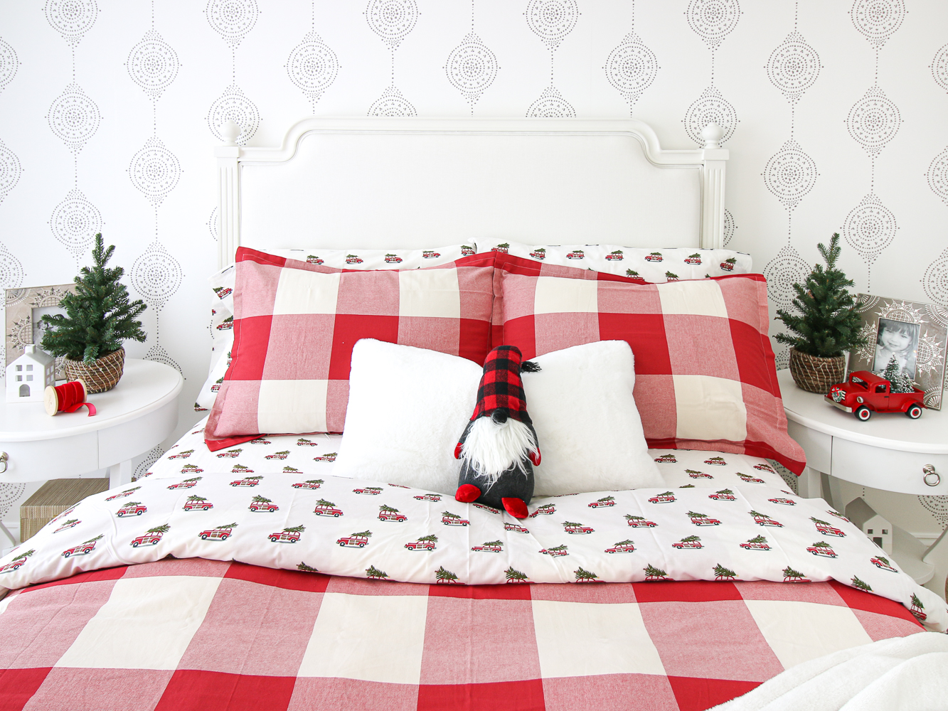 Girl's Christmas bedroom, gnome, mini trees, red and white bedding, sheets with red truck and trees, Serena and Lily wallpaper