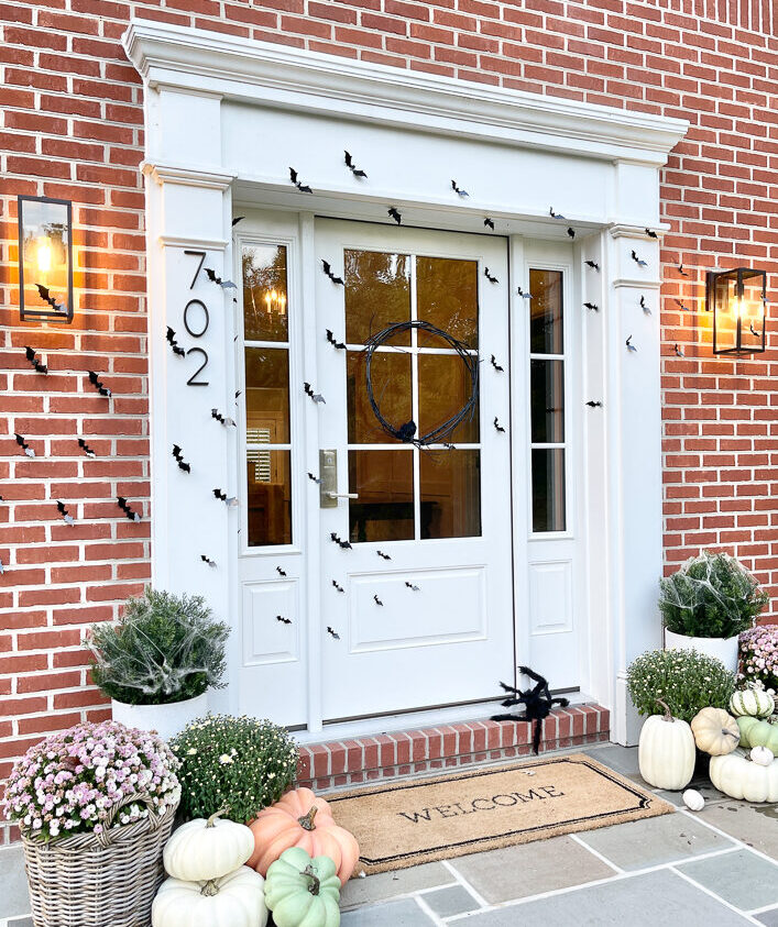 classy halloween decor, white front door, pumpkins