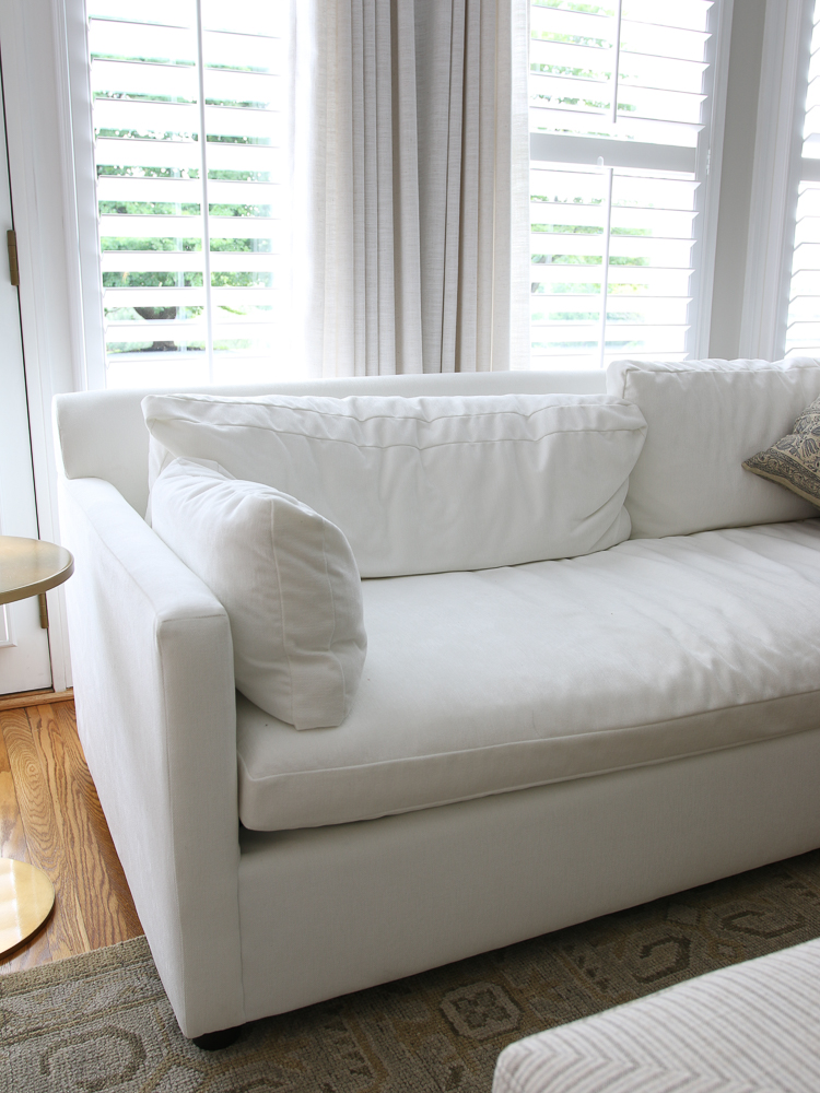 West Elm Marin velvet sofa in white distressed velvet before fluffing