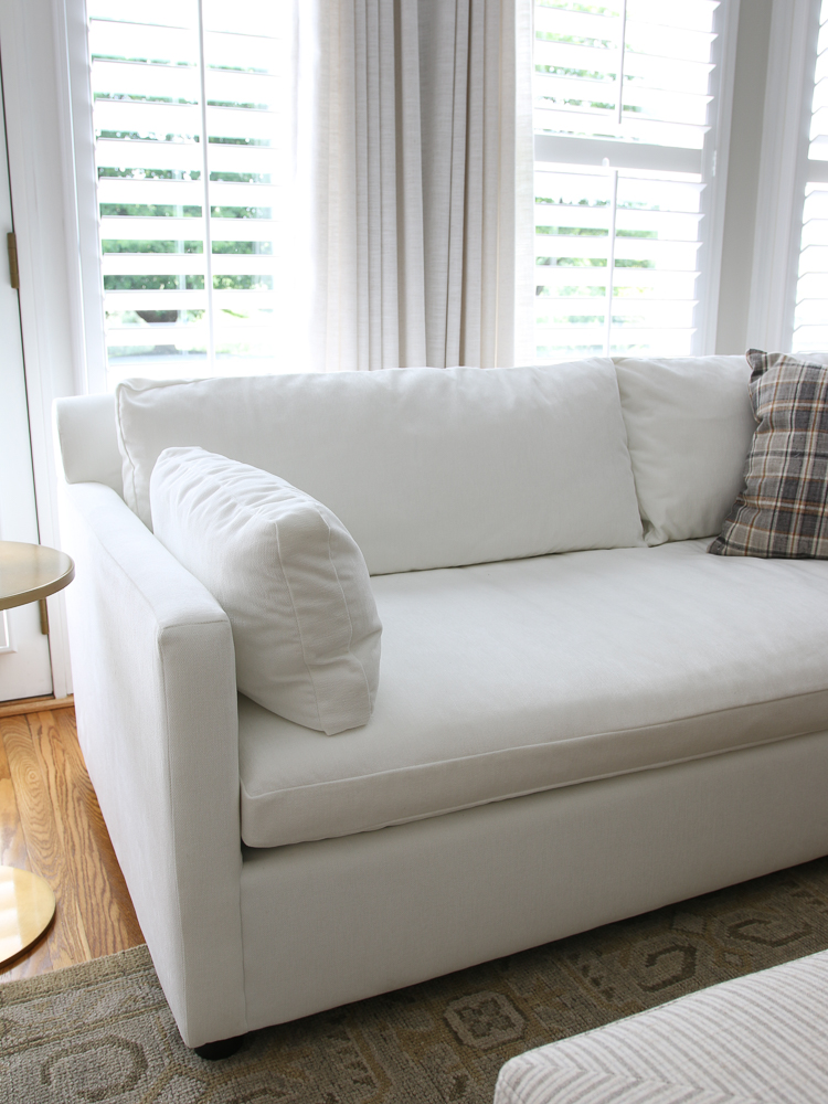 West Elm Marin velvet sofa in white distressed velvet after fluffing