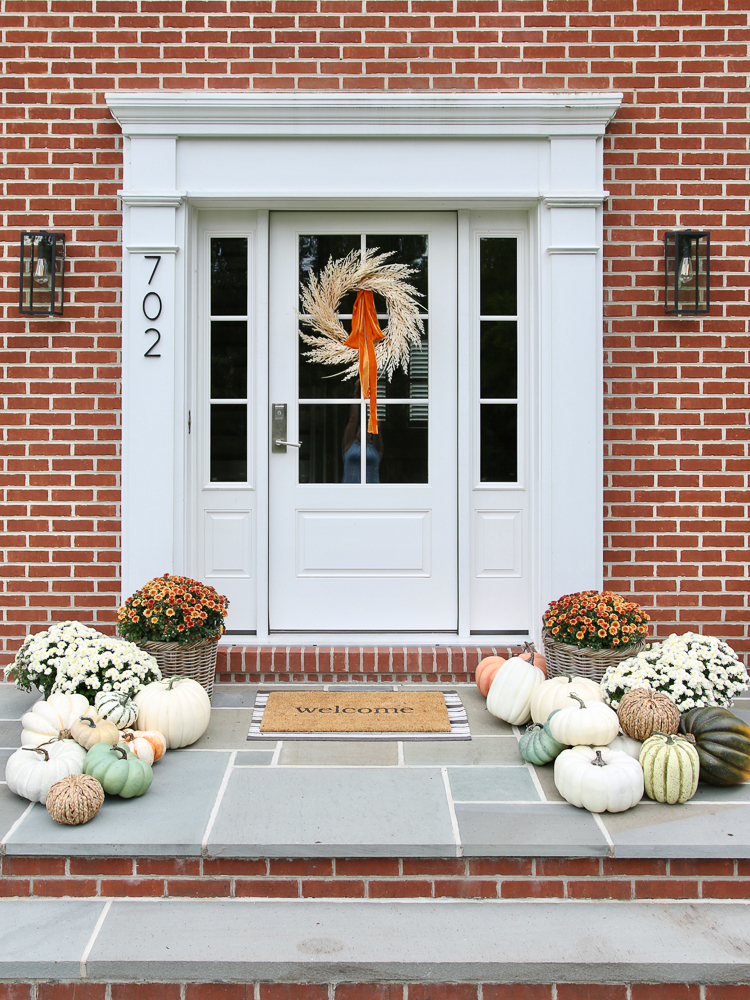 fall decor, front porch decor, pumpkins, fall wreath, brick home with bluestone porch