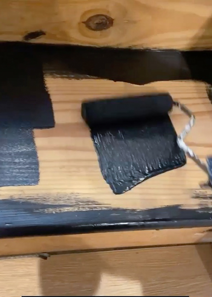 rolling black paint on stair tread