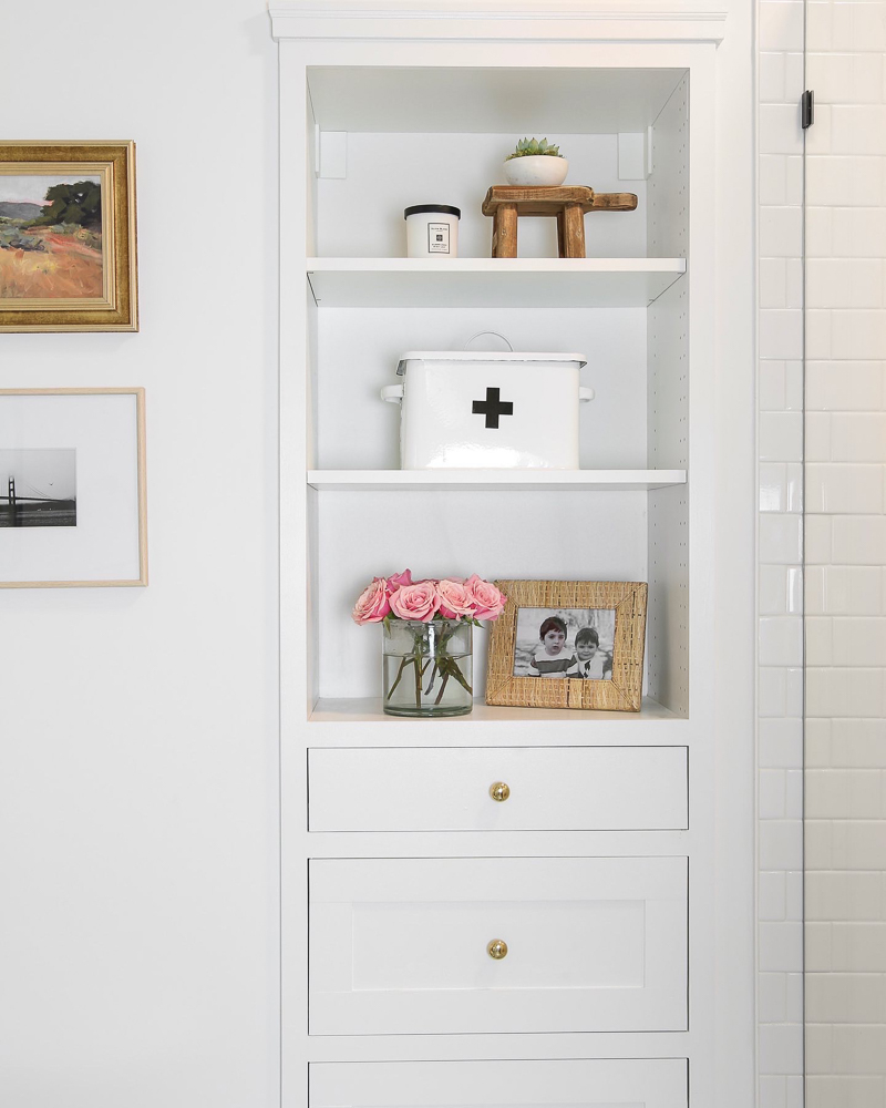 built in white storage cabinet with shelf decor and drawers