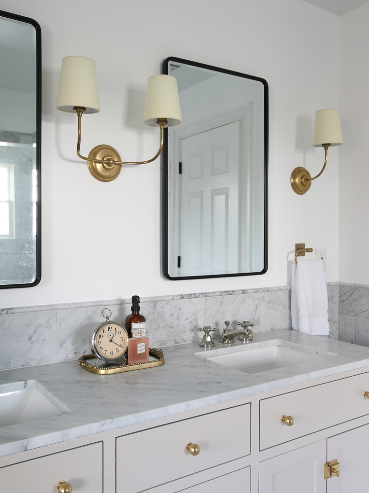 clutter free bathroom vanity with decorative tray, vanity mirror with closed hidden medicine cabinet