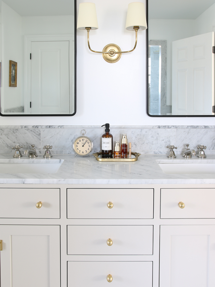 clutter free bathroom vanity, marble countertops, mirrors with hidden medicine cabinet