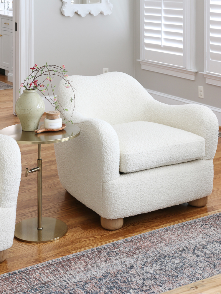 white boucle chair in living room