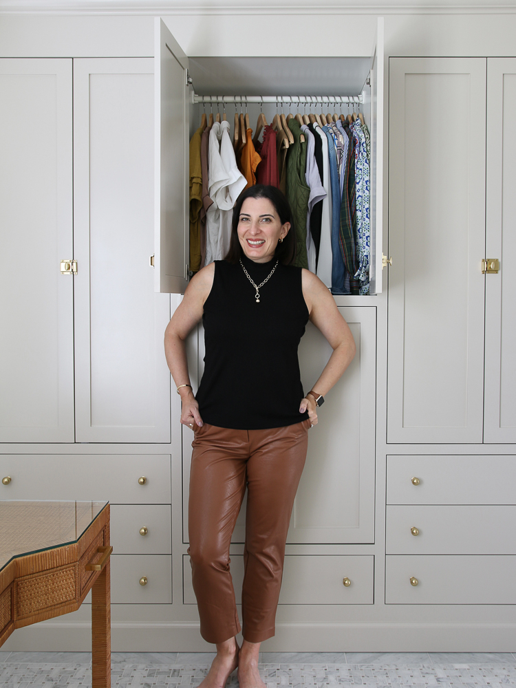 Stefana Silber standing in front of organized clothes cabinet, closet organization hacks that are easy to maintain