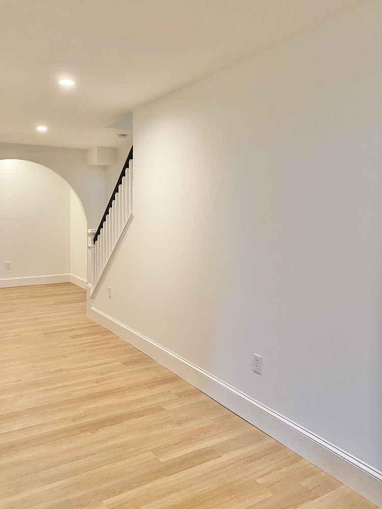 finished basement, white walls, oak LVP floor