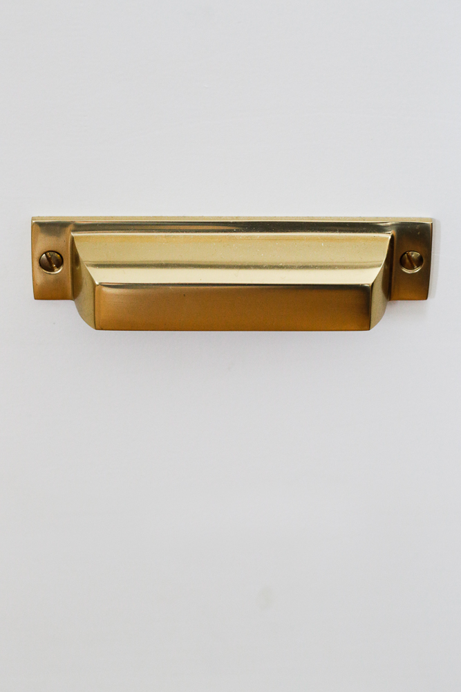 close up of brass bin pull