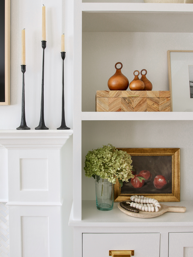 how to style shelves with varying sizes, shapes, and textures