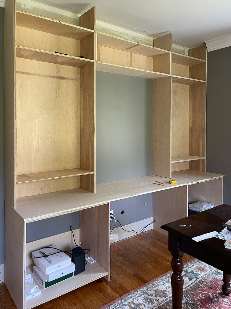 built in cabinet wall for home office with desk space 