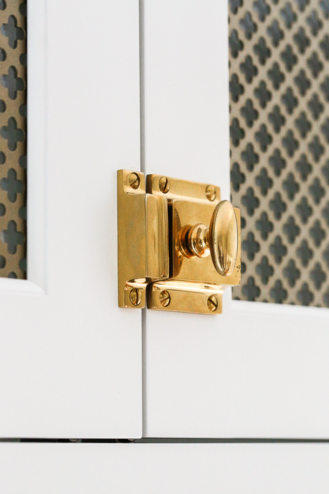 close up of unlacquered brass door latch
