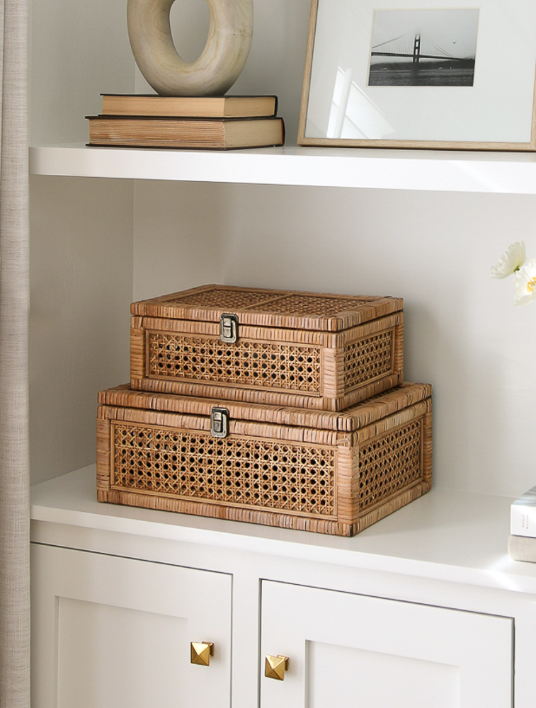 wicker decorative storage boxes styled on white built-in cabinets, one of Stefana Silber's favorite Amazon home decor items
