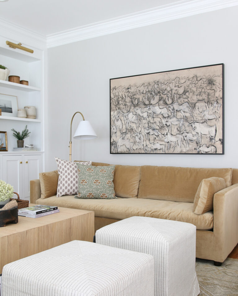 big wall in living room, large artwork over velvet Marin west elm sofa, agreeable gray wall, built-in shelves