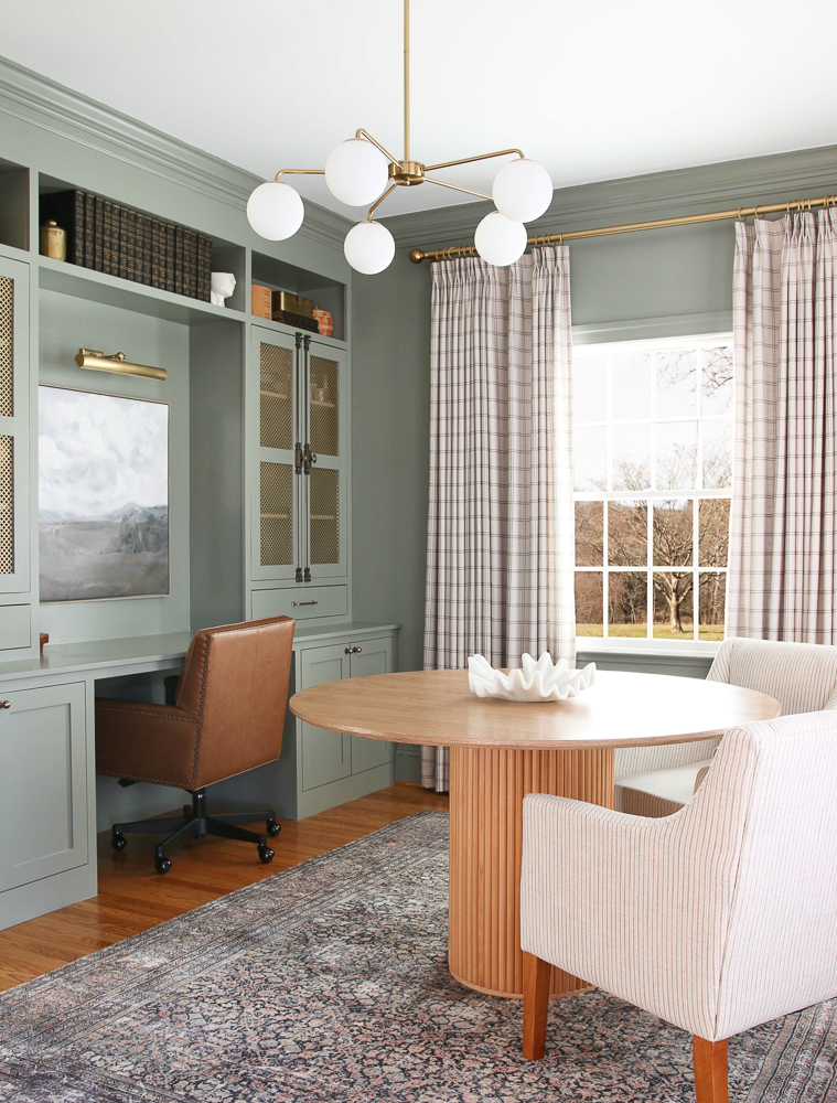 office built-ins painted BM Storm Cloud Gray, round wooden table, brass chandelier, printed Stefana Silber x Two Pages drapes