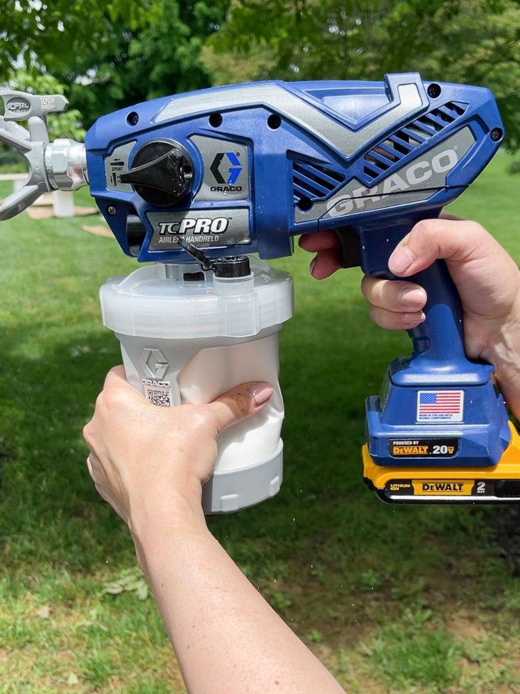 person holding best sprayer for painting cabinets, Graco TC Pro