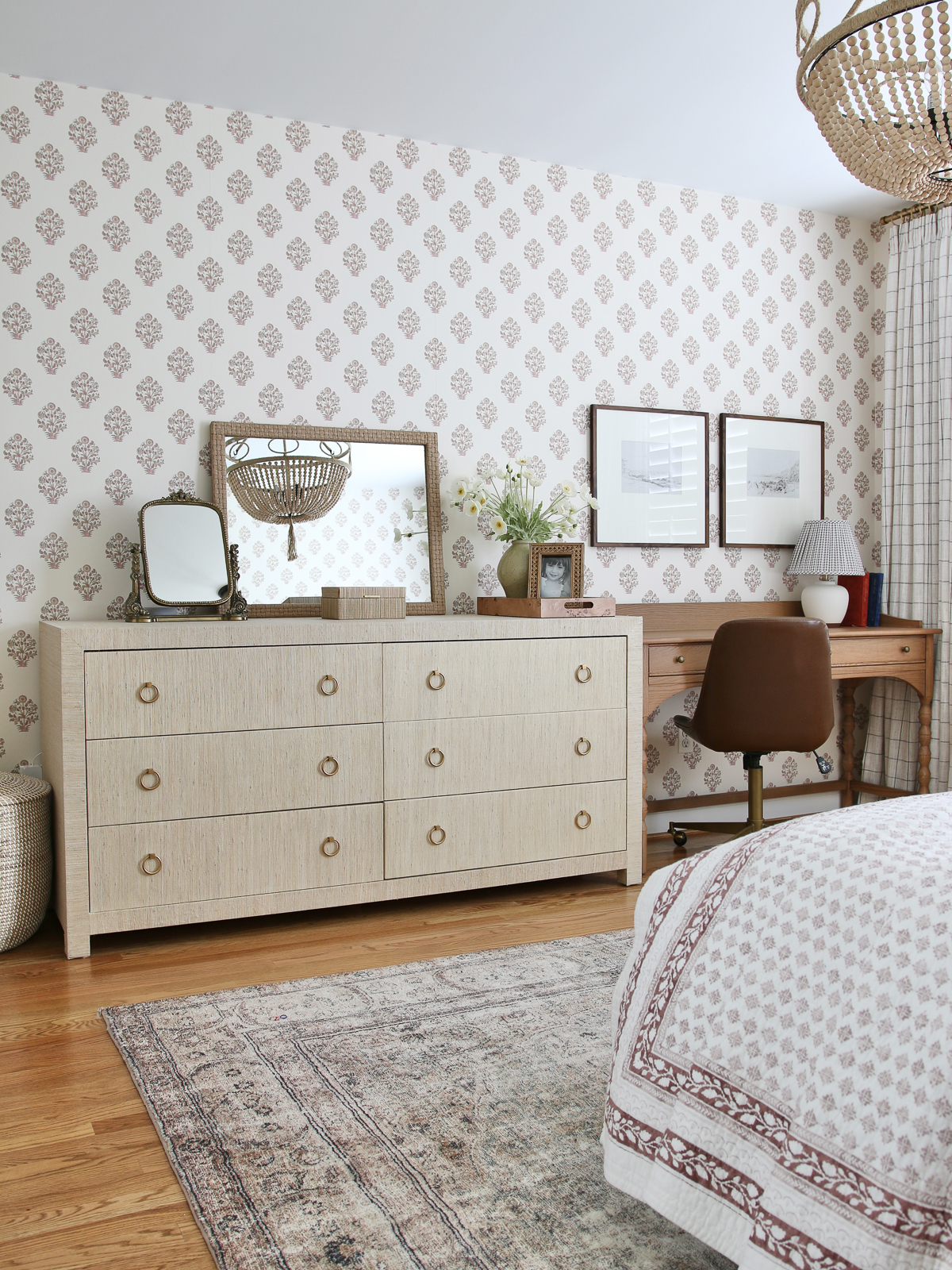 big girl bedroom ideas: block print wallpaper, seagrass wrapped desk, mid tone stained wood desk with turned legs,, vintage rug