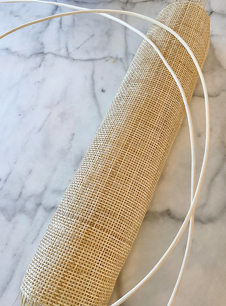 roll of cane webbing and spline on marble countertop surface
