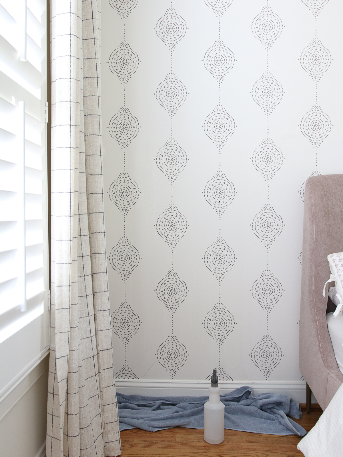 old Serena and lily wallpaper accent wall in bedroom