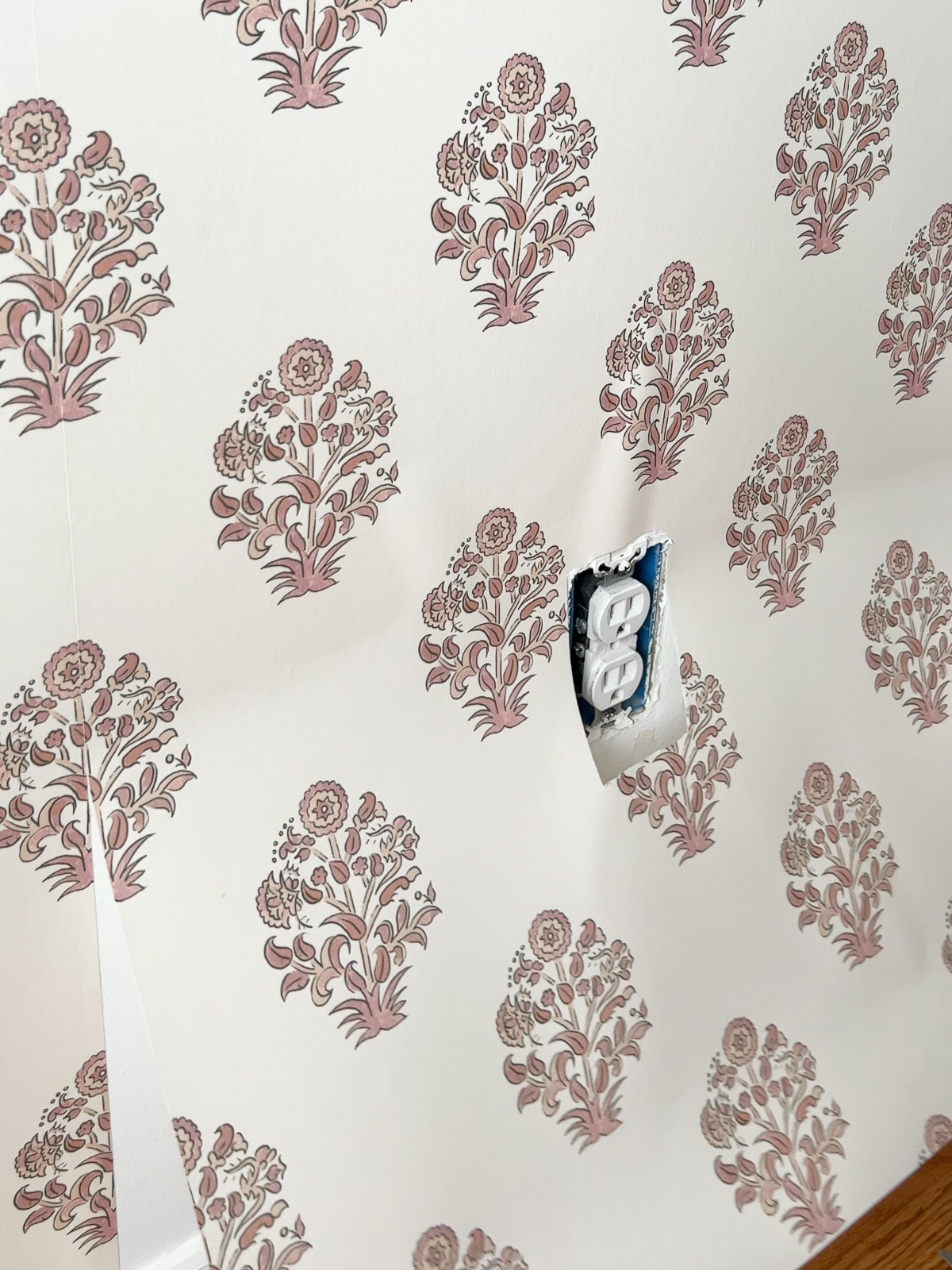 wallpaper with an electric outlet inside a hole