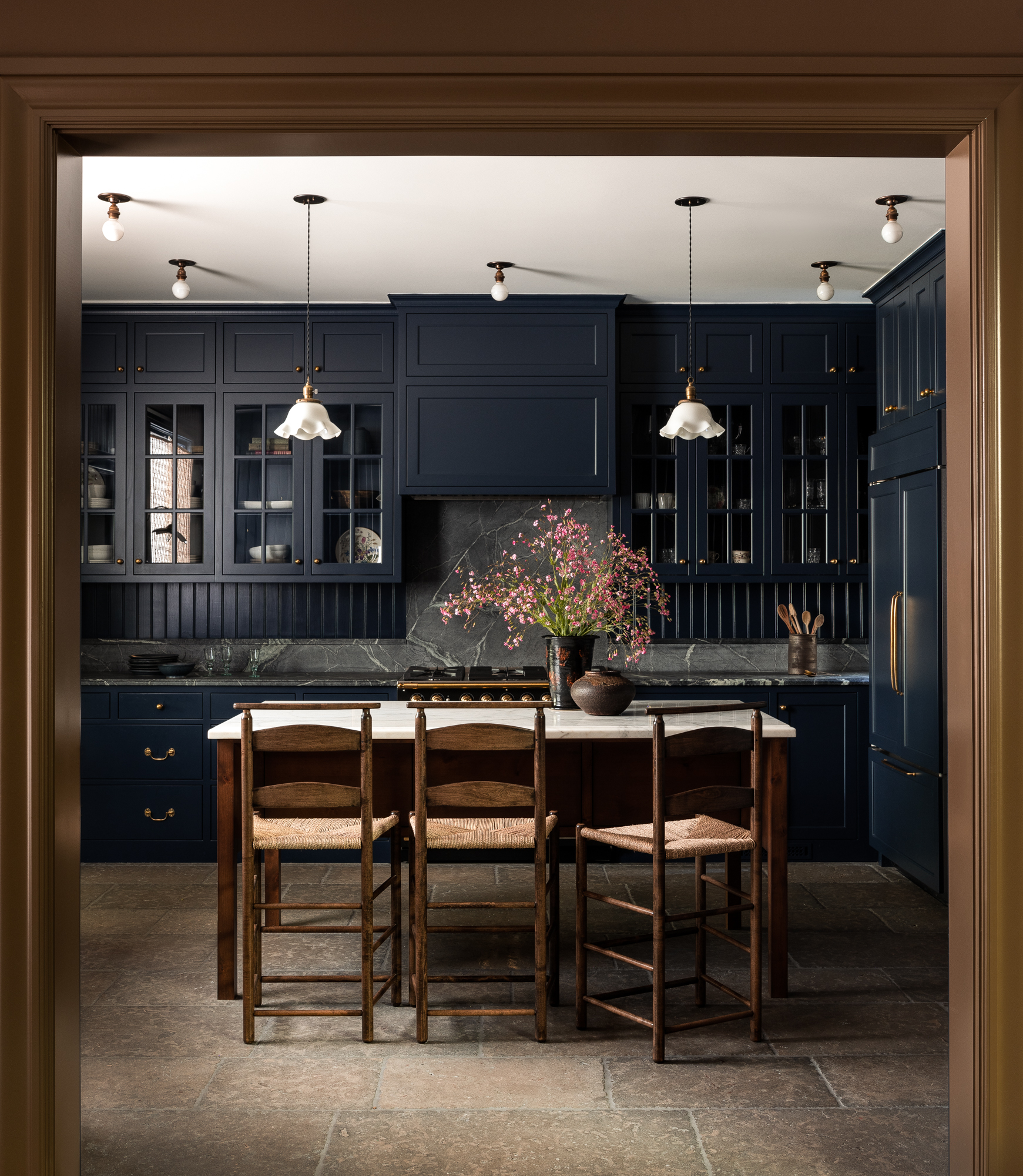 Heidi Caillier image of kitchen with dark blue cabinetry 