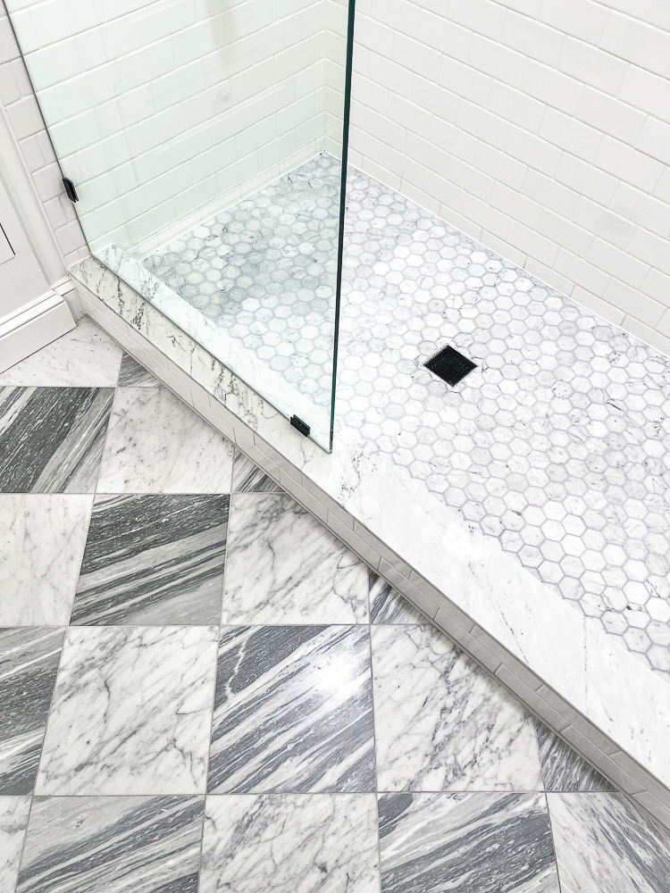 small basement bathroom floor, gray and white marble square checkerboard tiles, shower with hexagon  marble tiles and white subway tiles