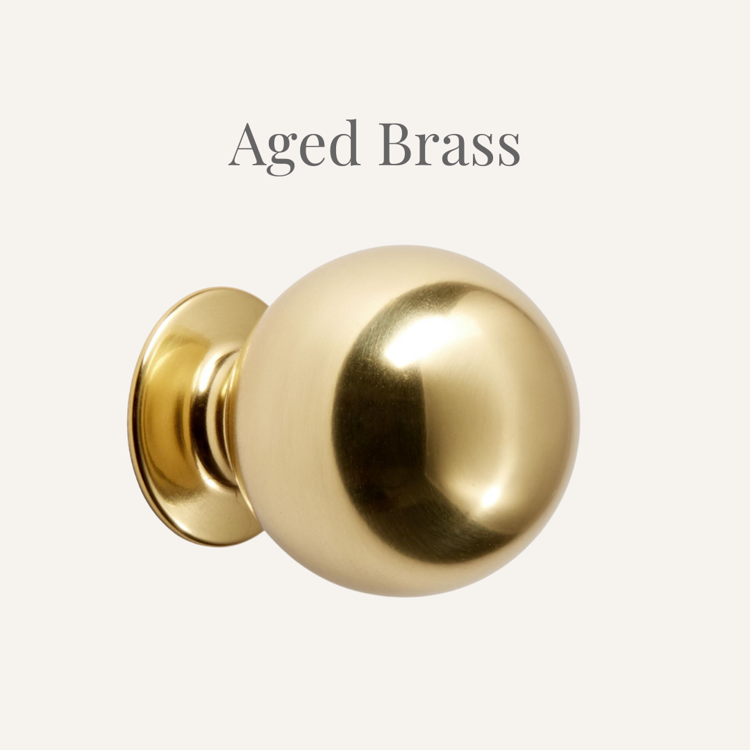 aged brass knob to be used in mixed metal bathroom design