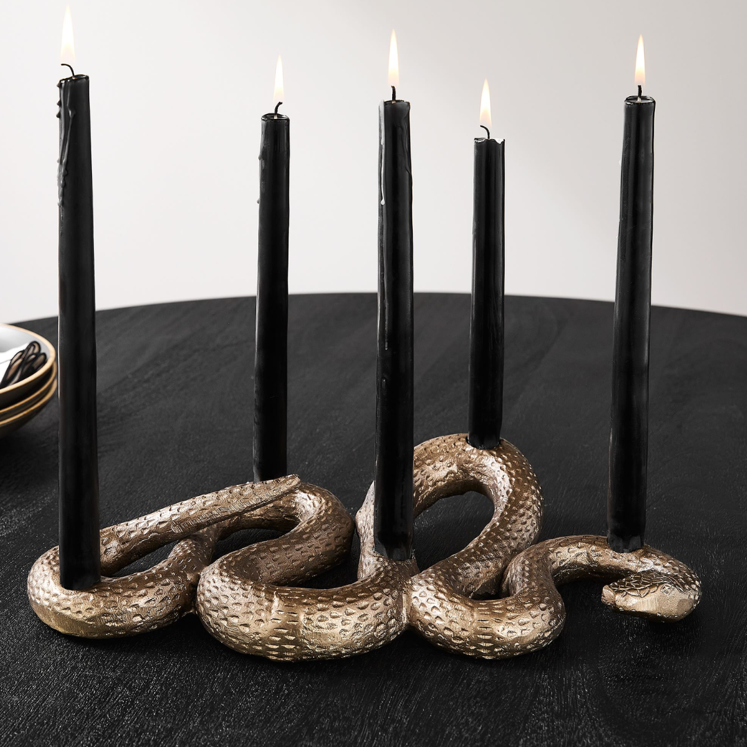 west elm product image of gold snake candelabra and black candles