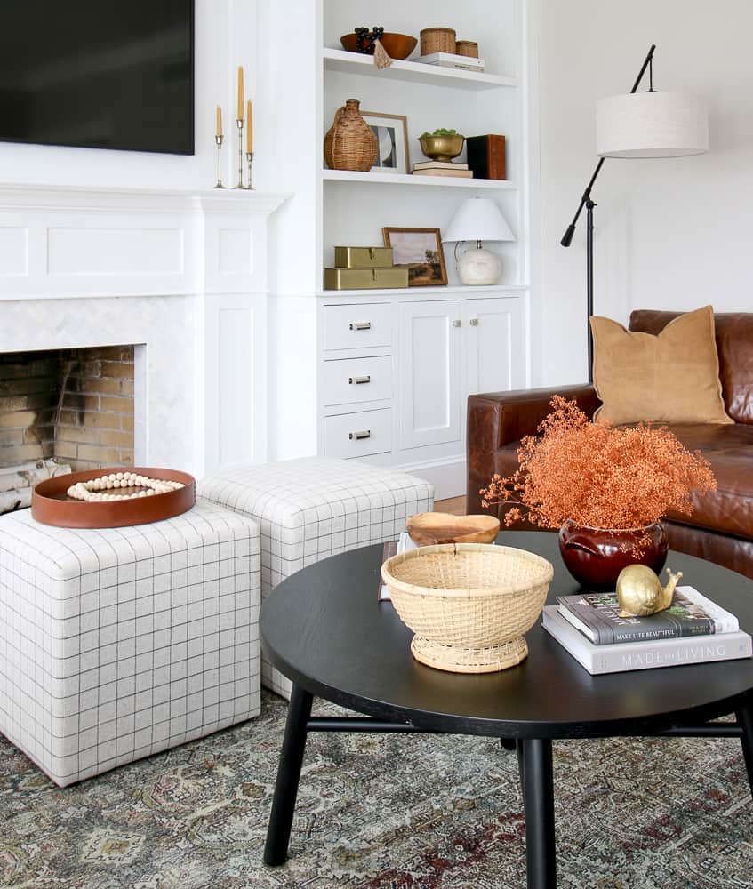 ottoman ideas for the living room, two window pane cube ottomans styled in front of a fireplace as extra seating