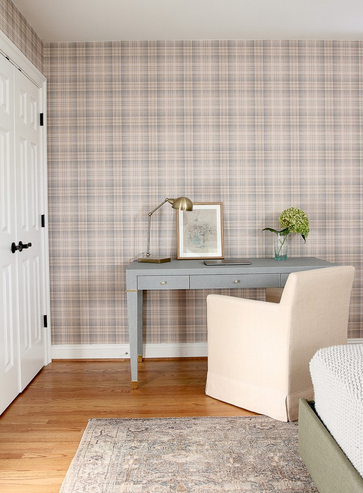 room refresh with wallpaper, plaid neutral wallpaper in bedroom desk setup along wall with linen chair