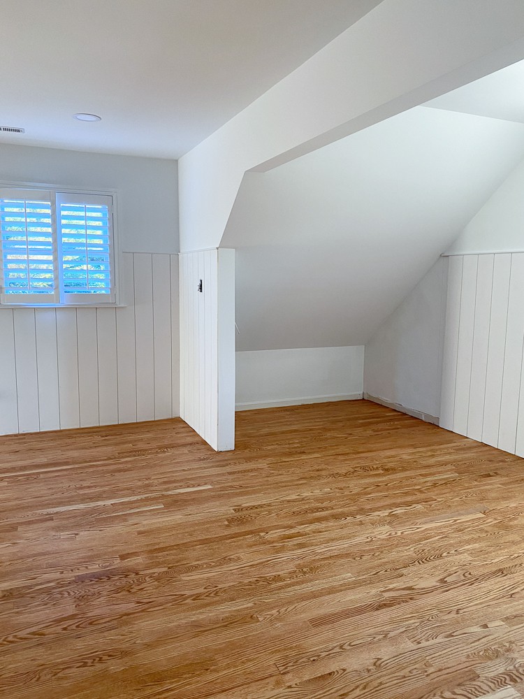 unfinished room with red oak hardwood flors stained Golden Oak by Minwax
