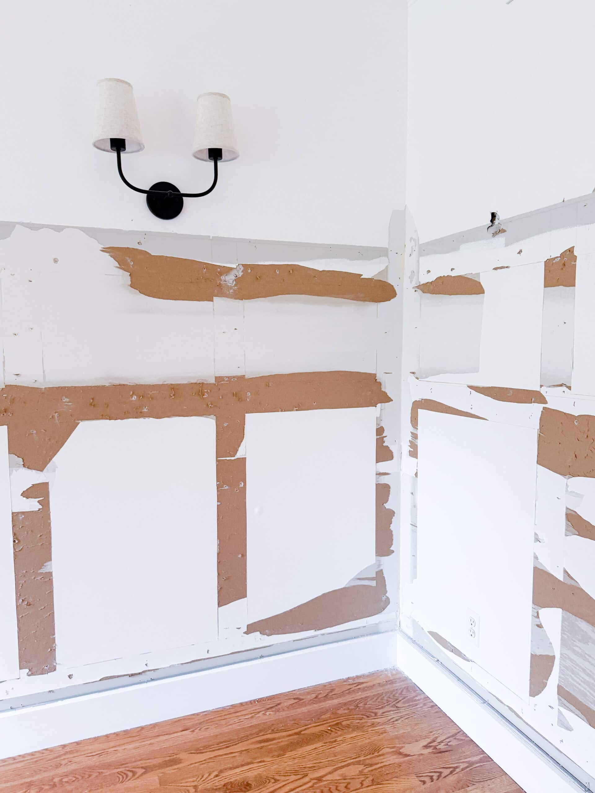 dining room with wall molding removed showing drywall damage